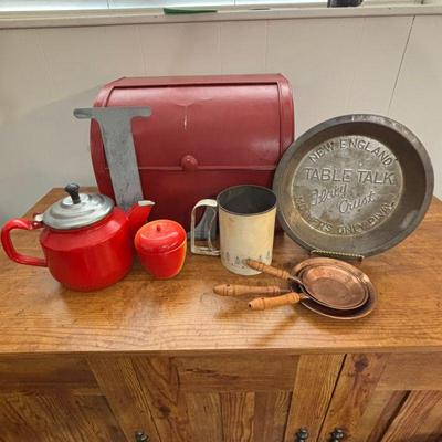 Lot #105 - Vintage Kitchen Collectibles Lot - Red Enamel Teapot, Table Talk Pie Pan, and More.