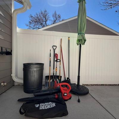 Lot #164 - Outdoor Equipment & Tools Lot - Black & Decker Leaf Blower, String Trimmer, Yard Tools, and 9’ Patio Umbrella.
