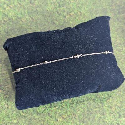 Lot #62 - Sterling Silver Station Bracelet.