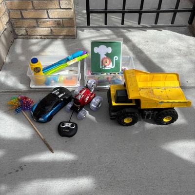 Lot #140 - Assorted Children's Outdoor Toys Lot Including Tonka Dump Truck and Remote Control Car