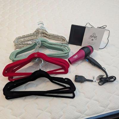 Lot #199 - Home Essentials Lot - Hangers, Hair Dryer, and Day Clock.