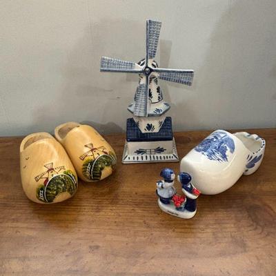 Lot #100 - Assorted Dutch Themed Collectibles - Wooden Clogs, Windmill Decor, and Figurines.