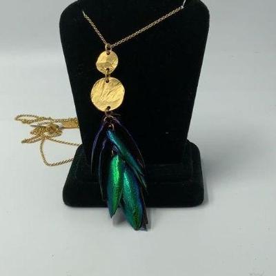 Beetle wings and gold
