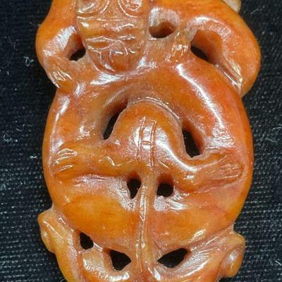 673: Asian Carved Red Jade Mythical Tiger Pendant
