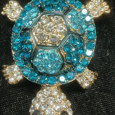305: Gold Tn Blue Crystal Articulated Turtle Brooch
