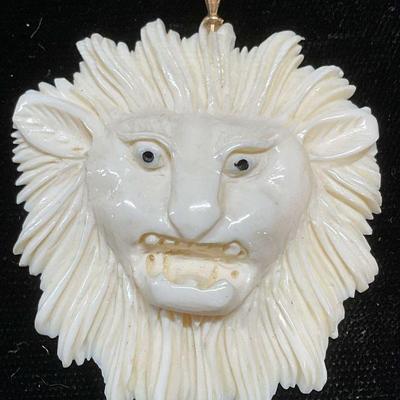 314: 14k Gold Hand Carved Bone Lion Pendant

