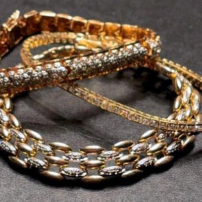 Trio of gold tone sterling bracelets