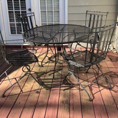 Wrought iron round table and 4 chairs