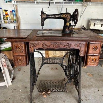 Vintage singer sewing machine with cabinet