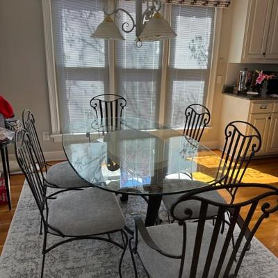 Marble Base with Iron and Glass Top Table. 2 Arm Chairs and 4 side chairs. Chairs have been recently recovered and extra fabric is...