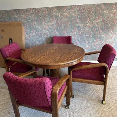 Round game Table with 4 Rolling Chairs. top will flip to a felt top as shown in next picture. Table is 42" Round x 29 1/2"...