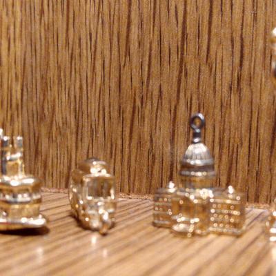 Gold Sternwheeler Stamped 14K, Sterling Capital & Other Charms 