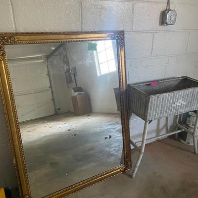 Large gold mirror, wicker plant stand