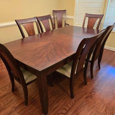 Nice Dining Table with 8 Chairs (includes extra leaf and pads)