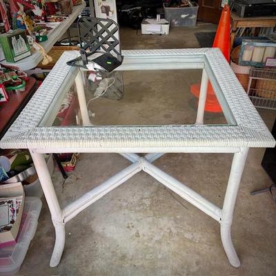 White wicker square table and four chairs