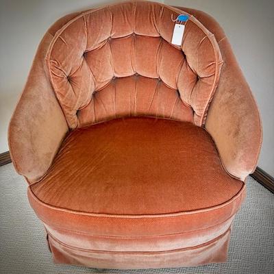 One of two mid-century velvet club chair