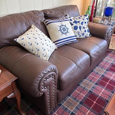 Brown leather loveseat