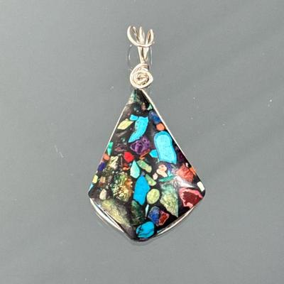 SILVER SPECIMEN STONE PENDANT | Sterling silver wirework pendant mounting a triangular specimen stone with turquoise and other colorful...