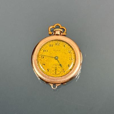 ELGIN GOLD-PLATED LADY'S POCKET WATCH | Yellow gold plated pocket watch of small size, the brass face signed "Elgin" and...