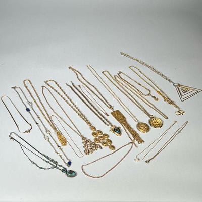 GOLD TONE COSTUME NECKLACES | Large lot of mixed gold-tone costume jewelry necklaces including; Swarovski crystal necklace, lockets,...