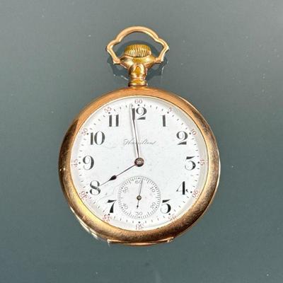 HAMILTON GOLD-PLATED POCKET WATCH | A Hamilton Watch Co. yellow gold plated pocketwatch, the face with Arabic numeral markers and...