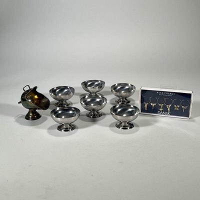(8pc) DANSK SILVER PLATE & OTHER ITEMS | Inclduing: Dansk silver plate wine charms, silver plate sugar scuttle, and 6 stainless steel...