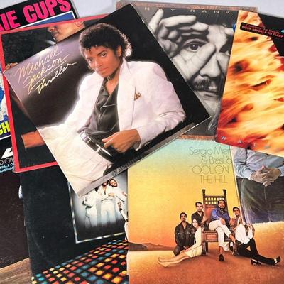 (9pc) MIXED LOT VINYL RECORDS | Mixed vinyl record albums including: Michael Jackson "Thriller" (QE 38112) April Wine...