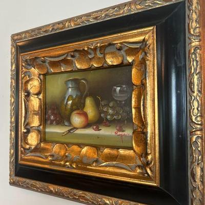 Original in solid wood frame. 