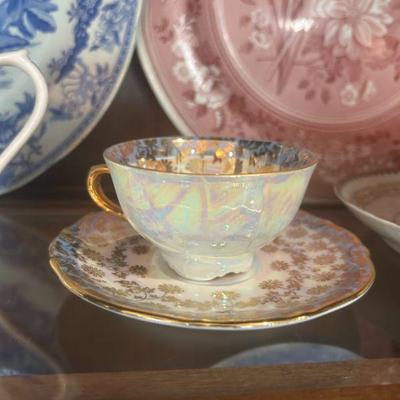 Vintage iridescent Tirschenreuth Bavarian 2 piece teacup and saucer set. 

