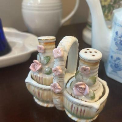 Japanese porcelain salt and pepper shakers and holder. 