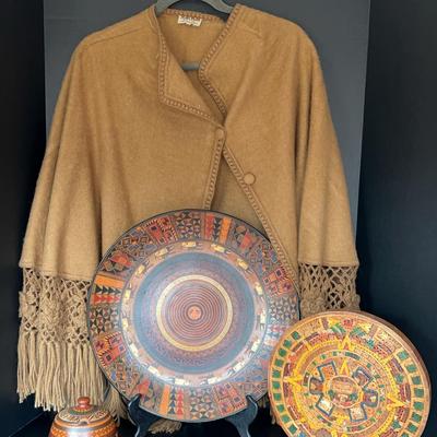 Souvenirs from Latin America: Aztec calendar, Inca Jar, Peruvian plate, and Alpaca Shaw