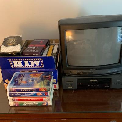 VHS Player, Tv, And VHS Tape Collection