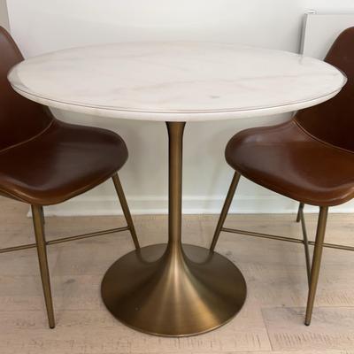 Tulip Style Table With White Stone Top And 2 Leather Chairs