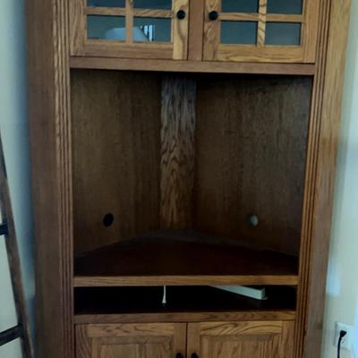 Large wooden corner entertainment cabinet