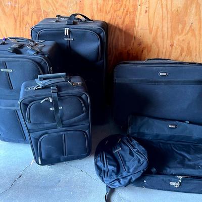 Two Sets Of Black Luggage. Embark & Jaguar (10 Total Pieces)