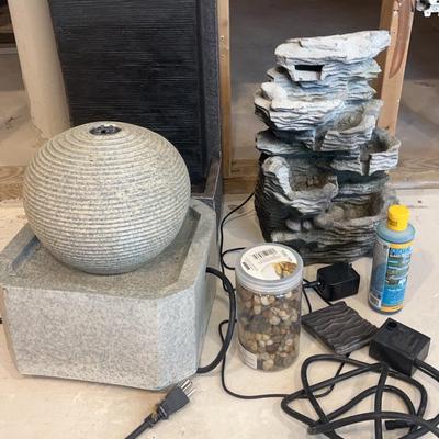 Trio of Stone-Textured Decorative Fountains