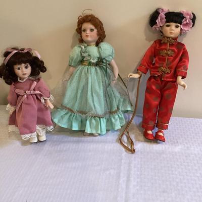 Trio Of Colorful Porcelain Dolls