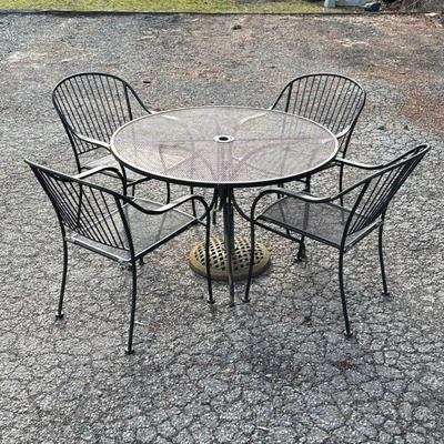 IRON PATIO SET | 6 piece iron patio set with four arm chairs, round table and umbrella stand. Arm Chair Measurements H: 33in W: 26in L:...