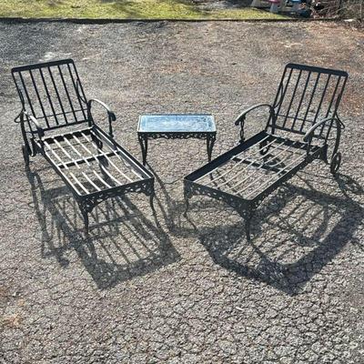 CAST IRON LAWN CHAIR SET | Two lawn chairs and a glass top side table Dimensions: h. 39 x w. 77 x l. 26-1/2 in

