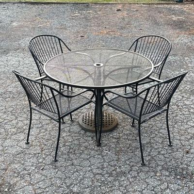 IRON PATIO SET | 6 piece iron patio set with four arm chairs, round table and umbrella stand. Arm Chair Measurements H: 33in W: 26in L:...