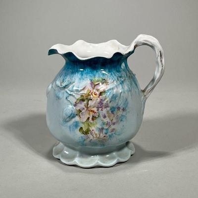 Ceramic Pitcher With Floral Design | With impressed number on bottom. Dimensions: h. 6.5 x w. 7 in

