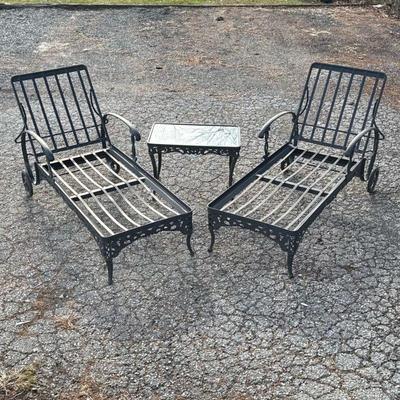 CAST IRON LAWN CHAIR SET | Two lawn chairs and a glass top side table Dimensions: h. 39 x w. 77 x l. 26-1/2 in

