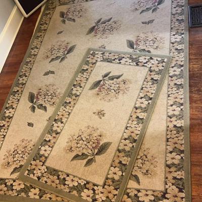 Two Matching Area Rugs In Green Tones With Floral Design