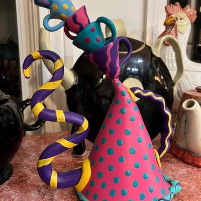 Whimsical Teapot with Stacked Cups