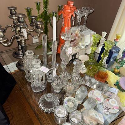 Glass and stainless candelabras and candlesticks