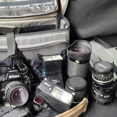 NIKON FILM CAMERA WITH SEVEN LENSES, BAG, FLASHES, AND MORE
