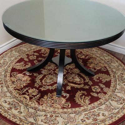 Round Glass-Top Pedestal Table with Ornate Red & Cream Area Rug | Rug Included