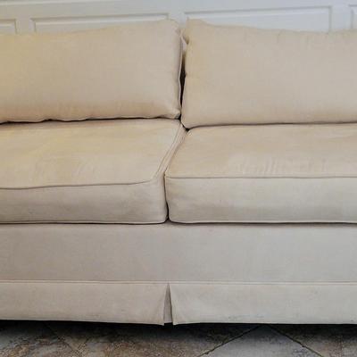 Cream Upholstered Sofa – Rolled Arms with Skirted Base 