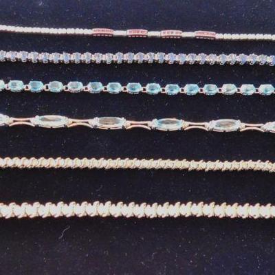 14KW tennis bracelets with Diamonds, Aquamarine, Blue Topaz and Ruby