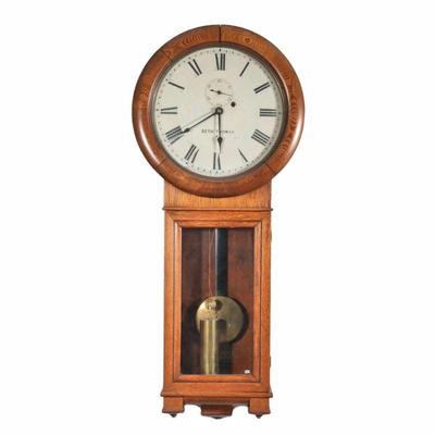 "SETH THOMAS REGULATOR WALL CLOCK | Oak regulator c. 1886-1900, the face with Roman numeral markers and sub seconds dial
h. 35 x d....